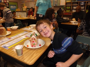 So proud of his gingerbread house!